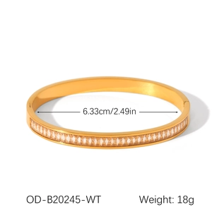Macro detail of gold-plated bangle with cubic zirconia, size 6.33cm and weight 18g