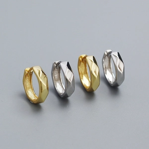 Close-up of S925 silver irregular faceted hoop earrings in gold and silver finishes