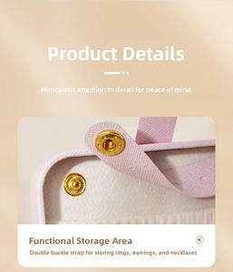 Detailed interior of pink travel jewelry organizer with snap-button ring storage straps