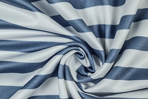 Macro detail of blue and white striped fabric texture with fine vertical knit patterns