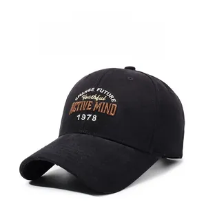 Detailed view of 3D embroidery on black brushed cotton baseball cap with curved brim