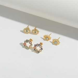 Three pairs of Evil Eye stud earrings in gold with colorful enamel and zircon accents