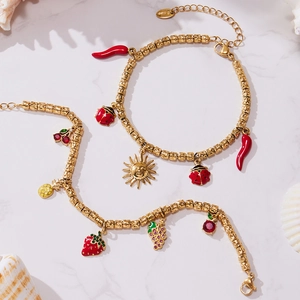 Gold-plated beaded bracelets featuring enamel sun, ladybug, and assorted fruit charms