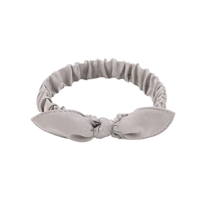 Detail of grey bow headband with elastic gathered fabric and bunny ear design