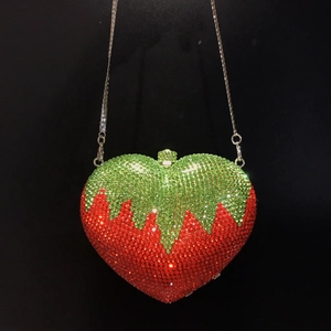 Luxury heart-shaped strawberry evening bag featuring red and green rhinestones