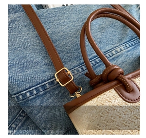 Detail of adjustable metal buckle on beige woven straw bag with brown leather strap