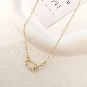 Elegant gold-tone double interlocking oval rings necklace with micro-pave crystals