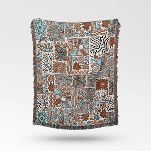 Detailed view of bohemian knit blanket with fringes and artistic sun shine pattern