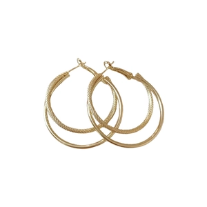 Elegant gold double interlocking hoop earrings with layered smooth and textured metal rings