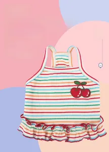 Detail of striped pet sling vest featuring 3D cherry embroidery and red wavy lace trim