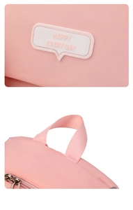 Detail of pink backpack silicone label and durable nylon hanging strap strap attachment