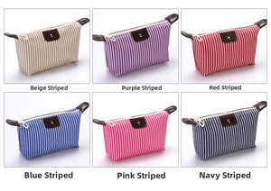 Detail view of colorful striped waterproof cosmetic bags with premium leather snap closure