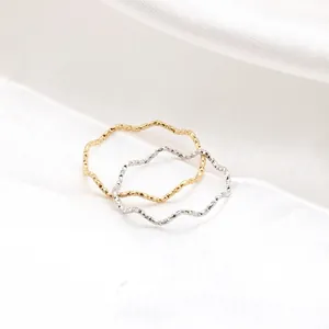 Minimalist wavy titanium steel rings in gold and silver finish with hammered texture