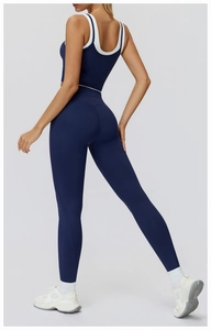 Detail of navy blue high-waist yoga set showing back straps and contrast trim