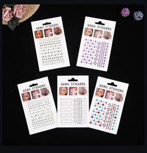 Macro shot of 5 assorted gem stickers sets including heart and star shapes in colorful tones