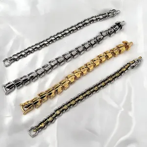 Retro punk dragon scale bracelets in gold and silver finishes on white silk fabric