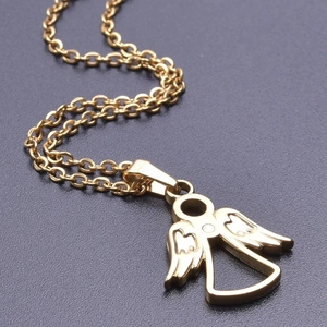 Detailed macro view of 18k gold plated angel pendant with heart cutouts on a cable chain