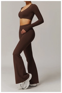 Side view of dark brown high-waisted yoga flared trousers and V-neck long-sleeve crop top
