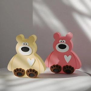 3D render of cute sitting bear molds in pink and yellow for DIY home decor