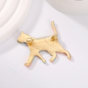 Back view of colorful cat enamel brooch with golden metal pin closure on white background