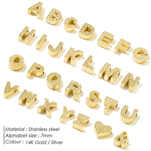 Macro view of 7mm micro-pave rhinestone letter charms in 14K gold plated stainless steel
