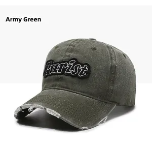 Detailed shot of distressed army green baseball cap with Purist embroidery and frayed edges