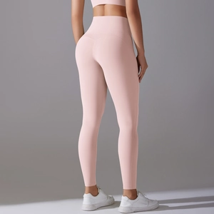 Rear view of high-waist peach yoga leggings highlighting back contouring and fit