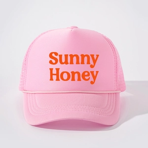 Pink trucker hat with orange Sunny Honey printing and breathable mesh back for daily sun protection