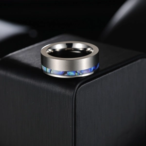 8mm silver titanium steel ring with abalone shell inlay on a black display box