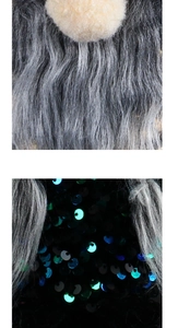 Detail of Halloween gnome featuring grey faux fur, plush nose, and shimmering black sequins