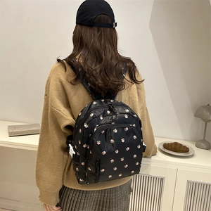 Minimalist black floral nylon backpack with adjustable straps for women and girls