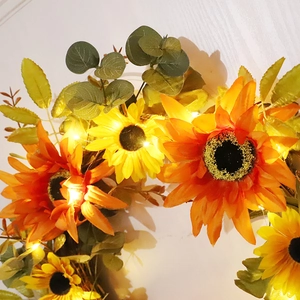 Autumn artificial sunflower wreath with warm LED lights and eucalyptus leaves decor