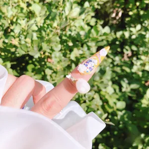 Detailed view of 5D embossed nail stickers featuring pearl accents and cute girl motifs