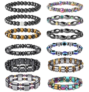 Macro view of 12-piece magnetic hematite and tiger eye beaded yoga bracelets collection