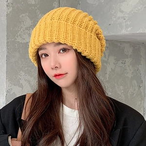 Bright yellow chunky knit beanie for women showing stylish texture and warm fit