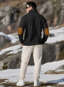 Detail of men's checkered jacket featuring contrast brown faux leather elbow patches