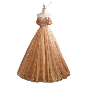 Elegant champagne gold evening gown with sequined bodice and puffed sleeves for events