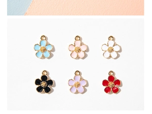 Detail of flower charms in six enamel colors with gold edges for DIY jewelry making