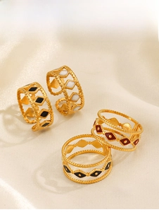 Detail view of retro gold-plated rhombus rings with colorful enamel oil on satin