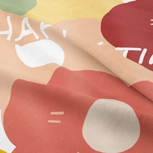 Detail of bohemian tapestry fabric showing abstract patterns and Happy Time print text