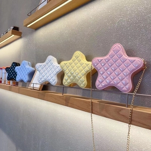 Quilted star-shaped crossbody bags in various colors with metallic gold chain straps