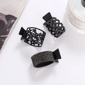 Three premium black metal hair claws featuring star cutouts and rhinestones on white