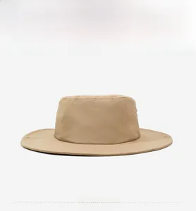 Detail view of khaki sun hat featuring metallic eyelets and durable quick-dry fabric texture