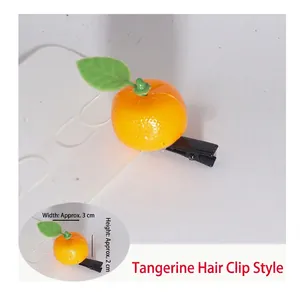 Detailed view of an orange sprout hair clip with size dimensions 3cm width and 2cm height
