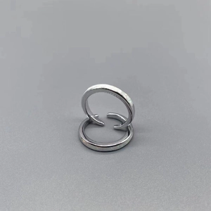 Detailed macro view of S925 sterling silver opal open toe rings on a gray background