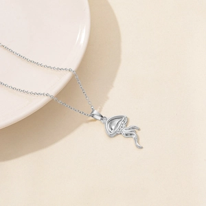 Detail of a silver jellyfish-shaped pendant necklace on a beige textured background