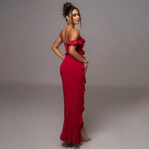 Detail view showing backless design and side slit of this red ruffled camisole maxi dress