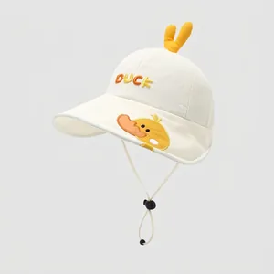 Detail of baby sun hat featuring yellow duck embroidery and 3D decorative sprout on crown