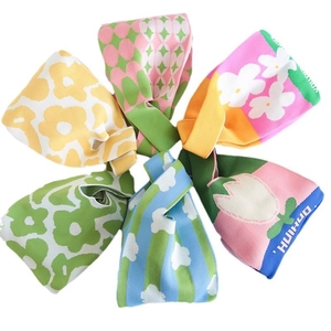Mini floral knit wrist bags in various colorful patterns and woven textures for women