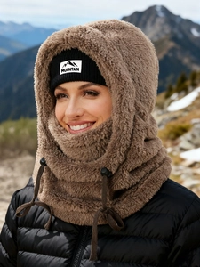 Detail of warm brown plush balaclava with black mountain label for winter outdoor sports